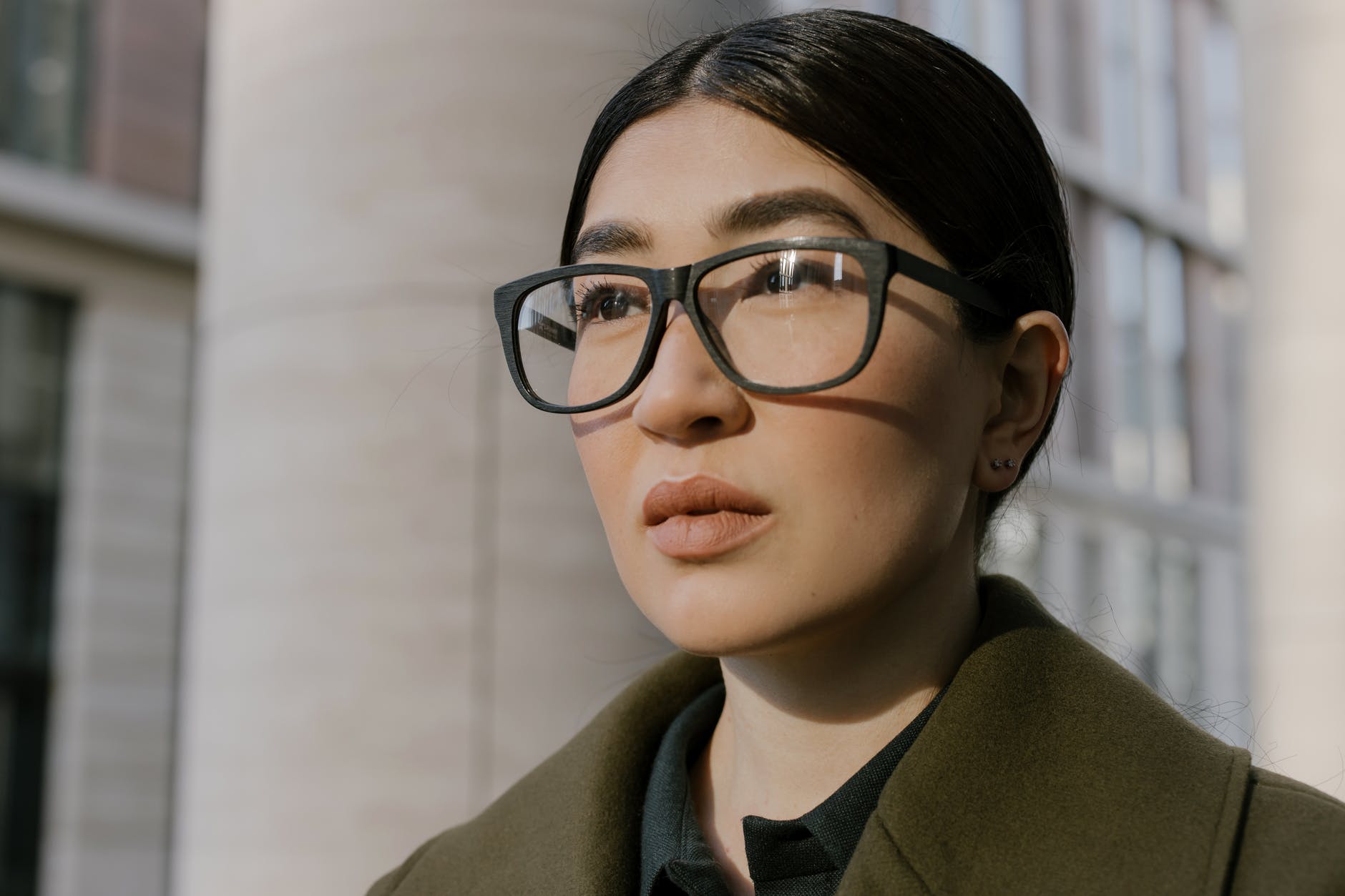 close up photo of a smart and confident woman